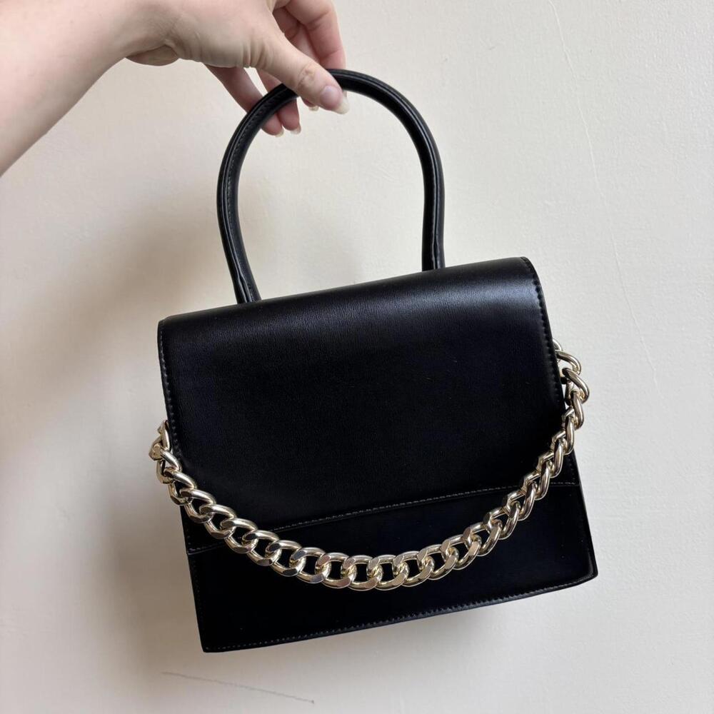 Black faux leather handbag with gold chain